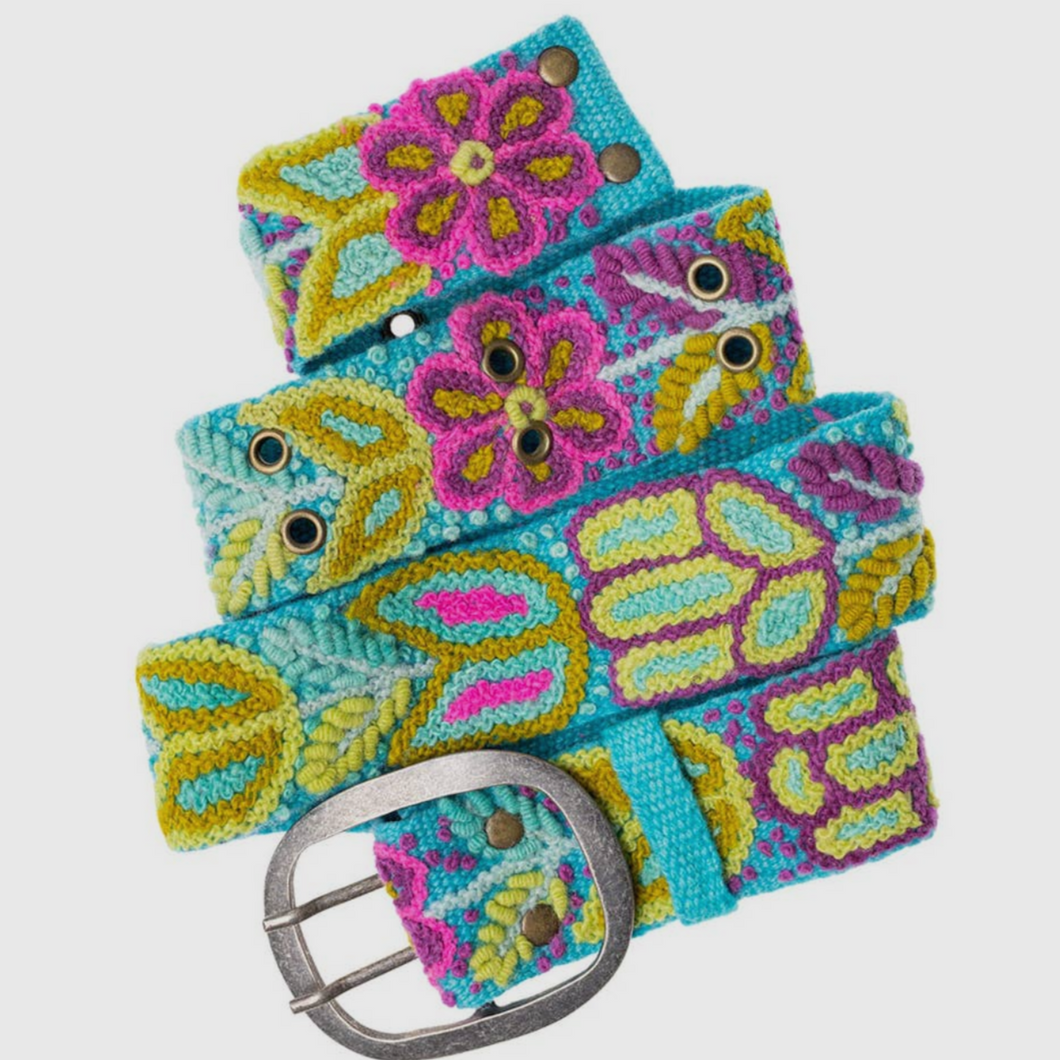 Colorful floral motif handwoven belt in wool fabrication with metal buckle. Colors include bright yellows, turquoise, and hot pinks.