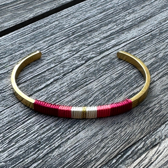 a unique cuff bracelet made by KAPIM by MM. It is made of stainless steel and silk thread and is adjustable to fit most wrists. The bracelet is available in a variety of colors, including Lavender Fields.
