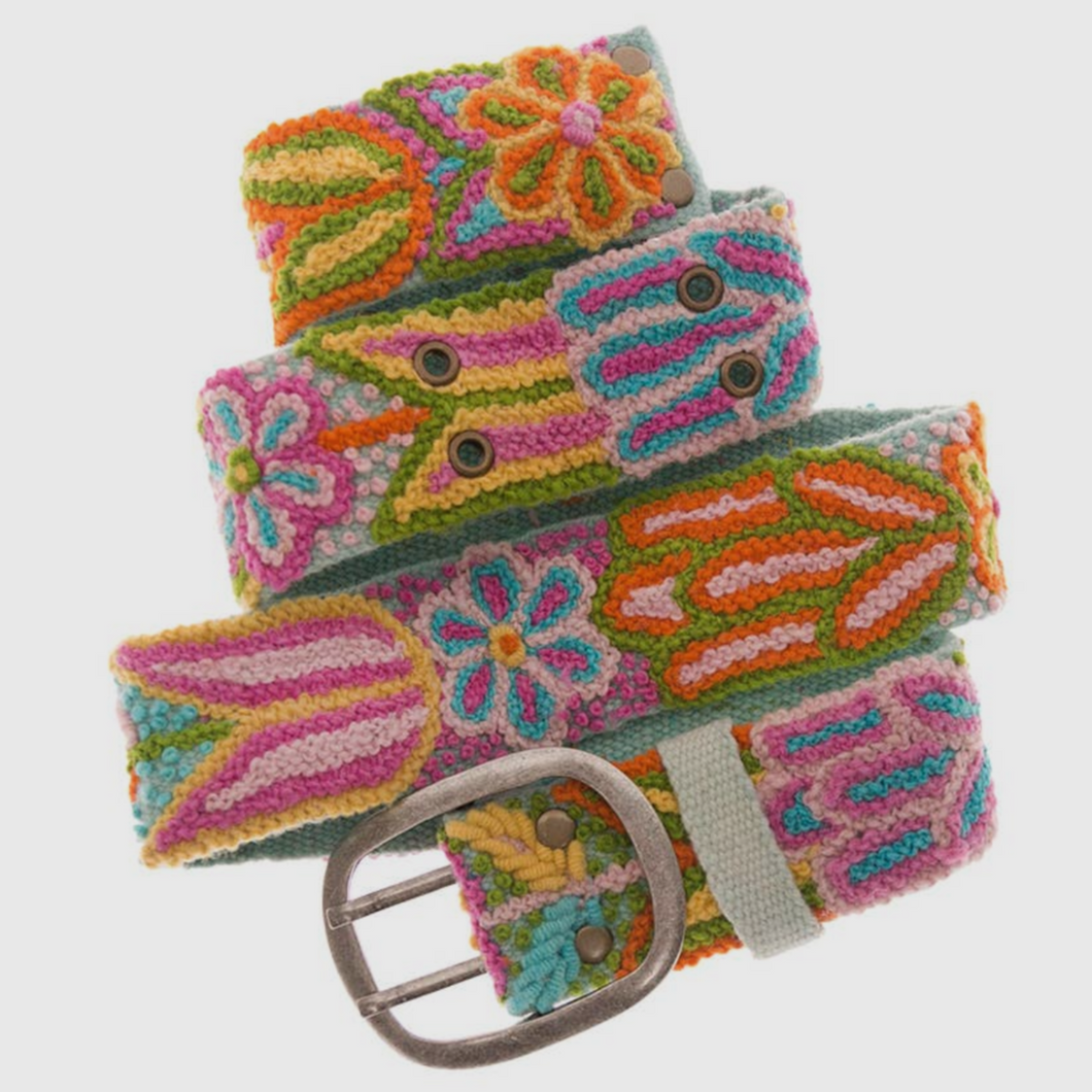 Colorful floral motif handwoven belt in wool fabrication with metal buckle. Colors include bright oranges, yellows, blues, and pinks.